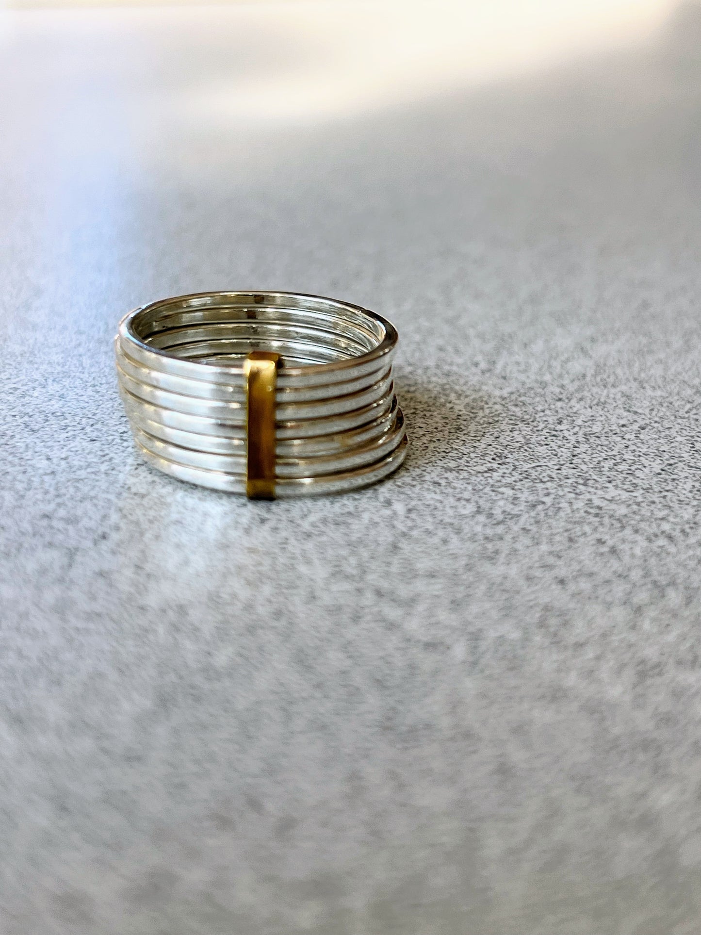 Stacked sterling silver 7 band ring with gold detail