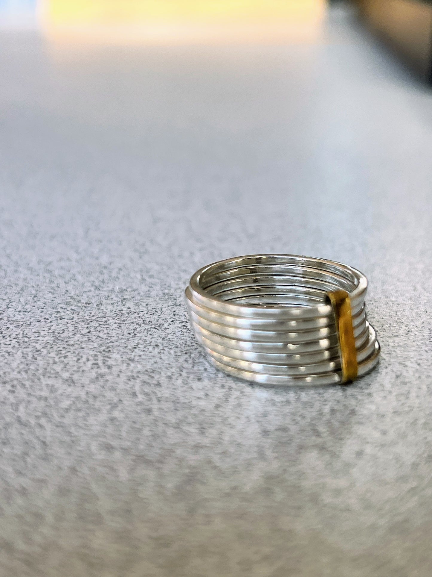 Stacked sterling silver 7 band ring with gold detail