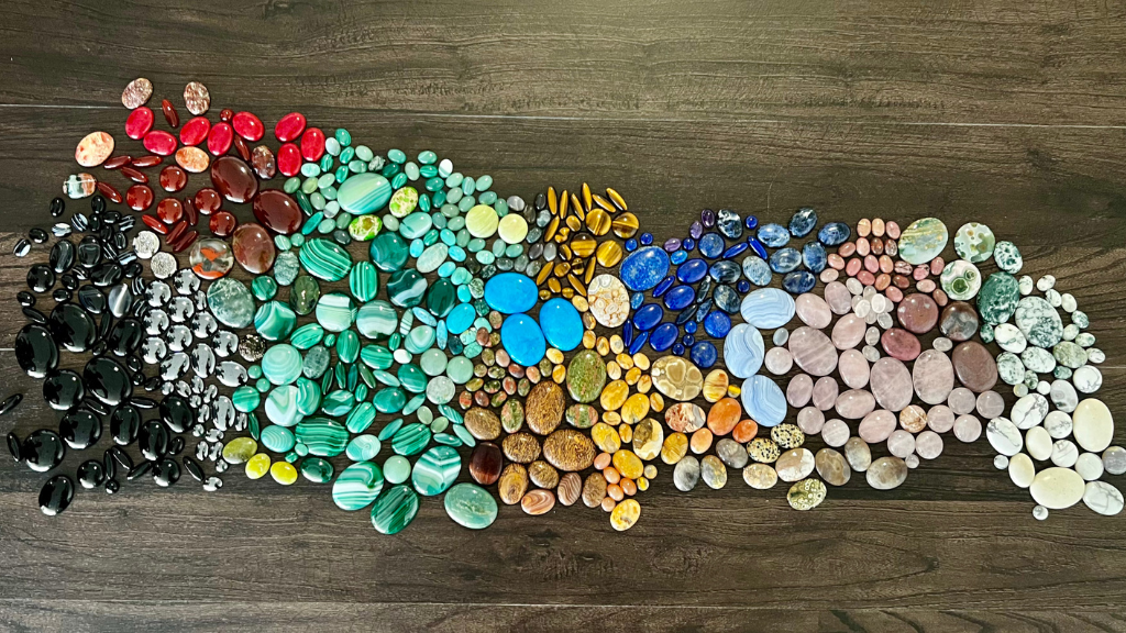 Hundreds of gemstones organized by color